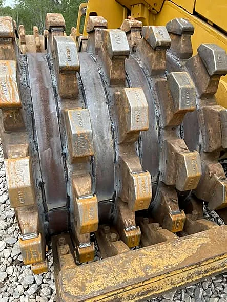 Refurbished Cat 815 compactor wheel with new tamping feet and fresh weld beads