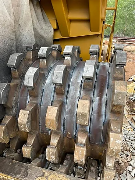 Fresh weld beads on rebuilt compactor wheel